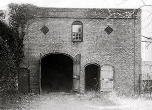 Photo of the Burgwin-Wright carriage house taken in 1938